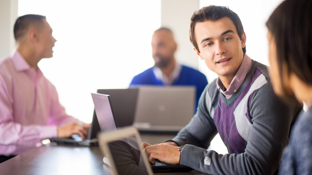 Corporate portrait - meeting laptops